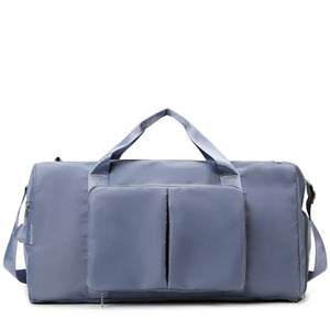 Duffel bag in Dusty Blue with two front pockets and dual top handles