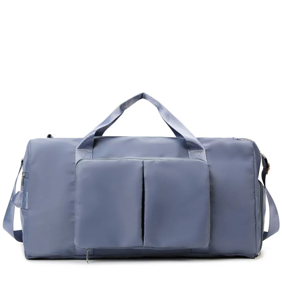 Duffel bag in Dusty Blue with two front pockets and dual top handles