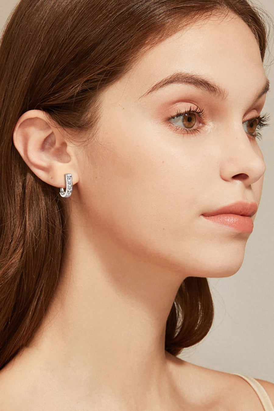 Silver pavé-set hoop earrings with a chic, polished finish.