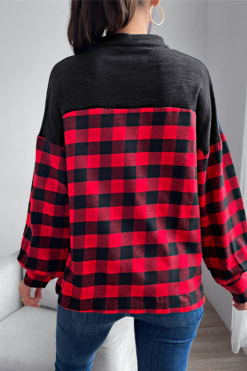 Black and red buffalo plaid henley top with contrast black sleeves and yoke.