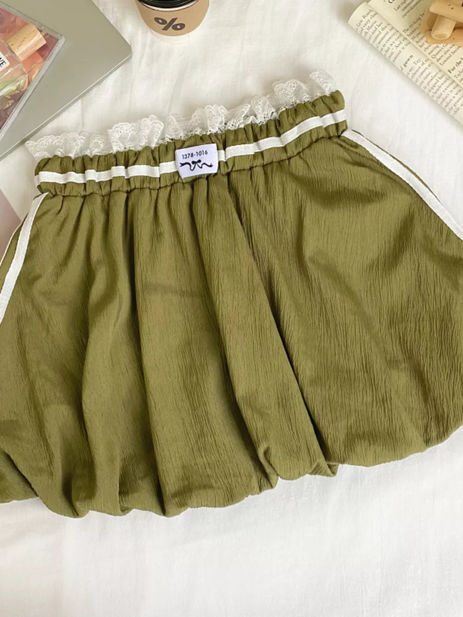 Army green mini skirt with lace trim, gathered waist, and white side stripes.