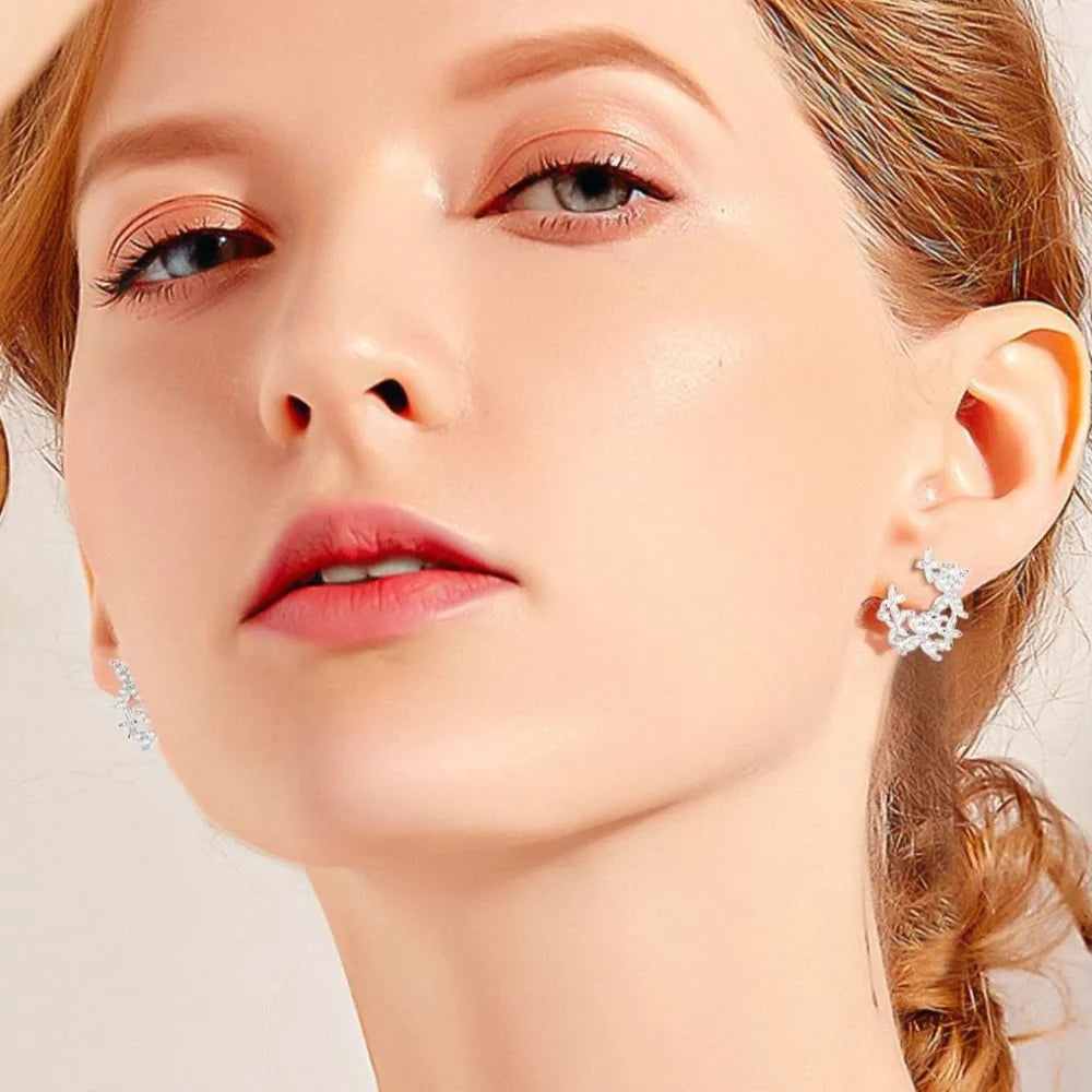 Silver floral cluster stud earrings with D color grade stones
