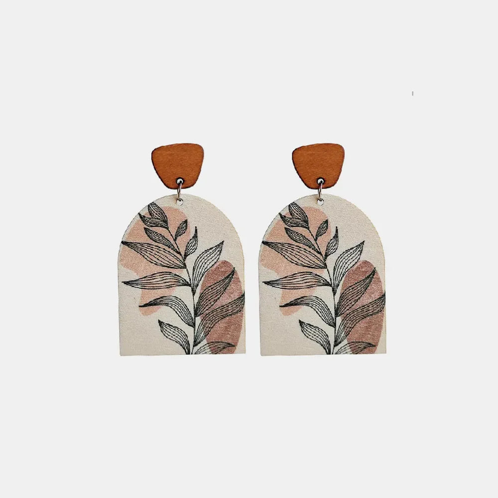 Botanical arch wood earrings in apricot with abstract leaf print.
