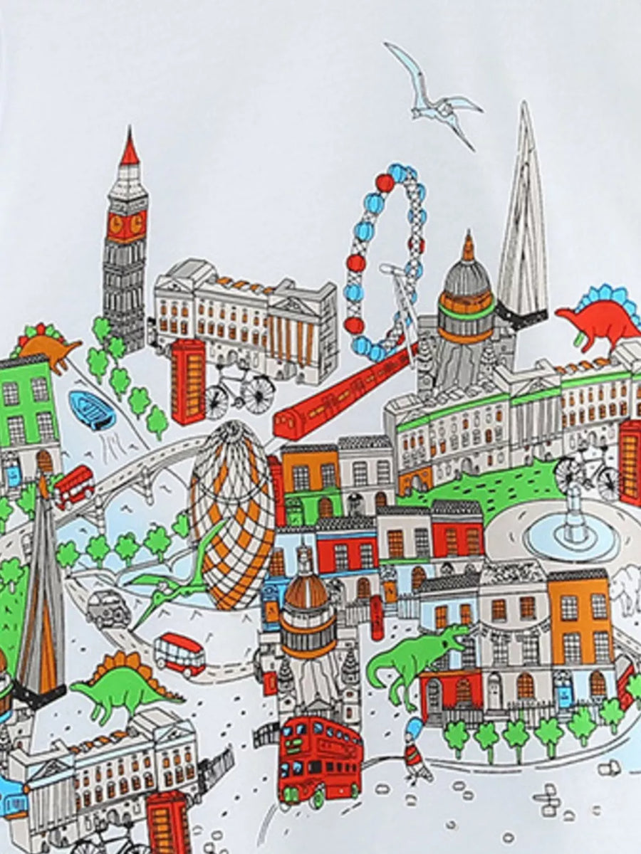 White t-shirt with a colorful London cityscape and dinosaur print.