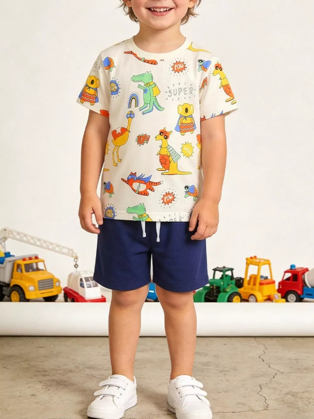 Boys' cotton t-shirt with cartoon animal adventure print, white with multi-color graphics.