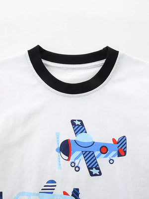 White toddler t-shirt with black trim and a blue airplane print.