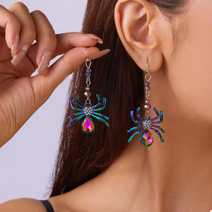 blue earrings featuring drop design and animal motif