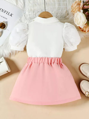 Baby pink skirt and white puff sleeve top ensemble with heart detail on sleeves