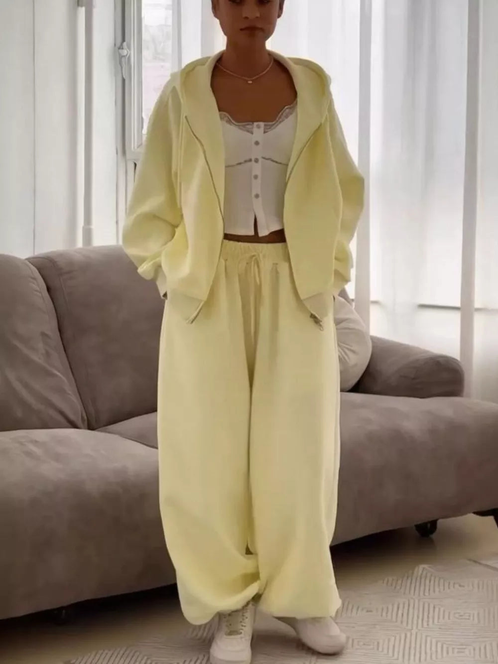 100% polyester Care instructions: Machine wash cold lounge set in Pastel Yellow with oversized silhouette