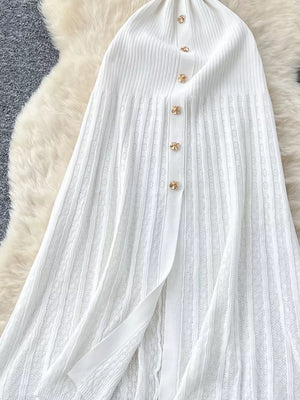 White knit dress with button front and intricate openwork pattern.