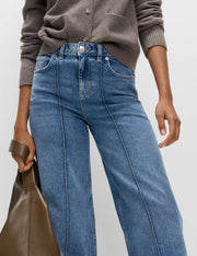 Seam-detail wide leg maternity jeans in blue denim with pockets.