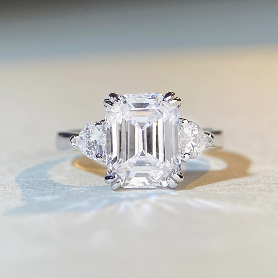 silver ring featuring zircon stones and geometric