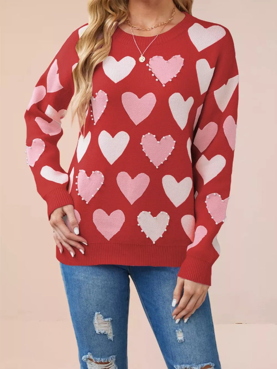 Red pullover sweater with seam detail and long sleeve