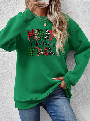 Green crewneck sweatshirt with "Merry Christmas Y'all" graphic in mixed prints and patterns.
