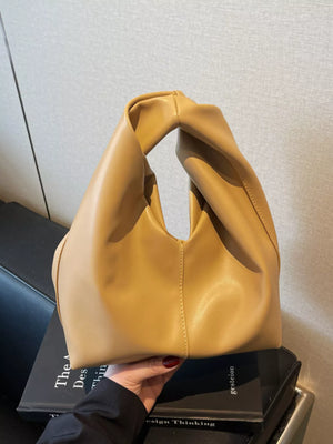 Khaki leather handbag with a twisted knot handle and slouchy silhouette.