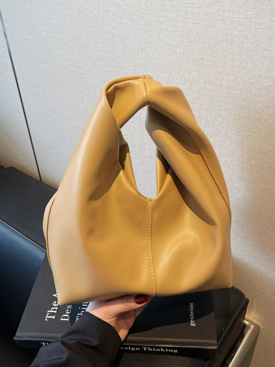 Khaki leather handbag with a twisted knot handle and slouchy silhouette.