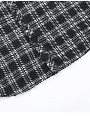 Men's black plaid button-up shirt with cotton blend fabric and classic silhouette.