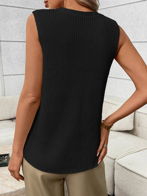 Black knit sweater vest with ribbed texture and curved hem.