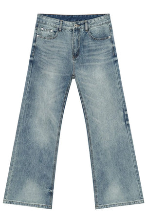 Medium wash denim bell bottom jeans with a wide leg and distressed details.