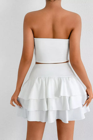 White strapless crop top and tiered ruffle mini skirt set