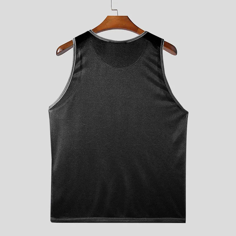 Black sequin mesh overlay tank top with contrast trim.