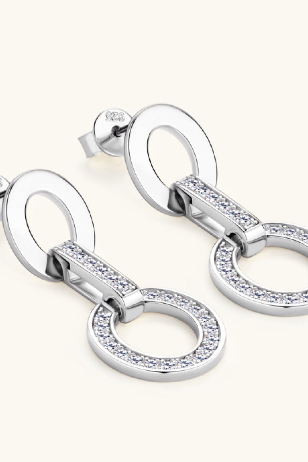 Silver geometric pavé drop earrings with oval links and sparkling cubic zirconia accents.