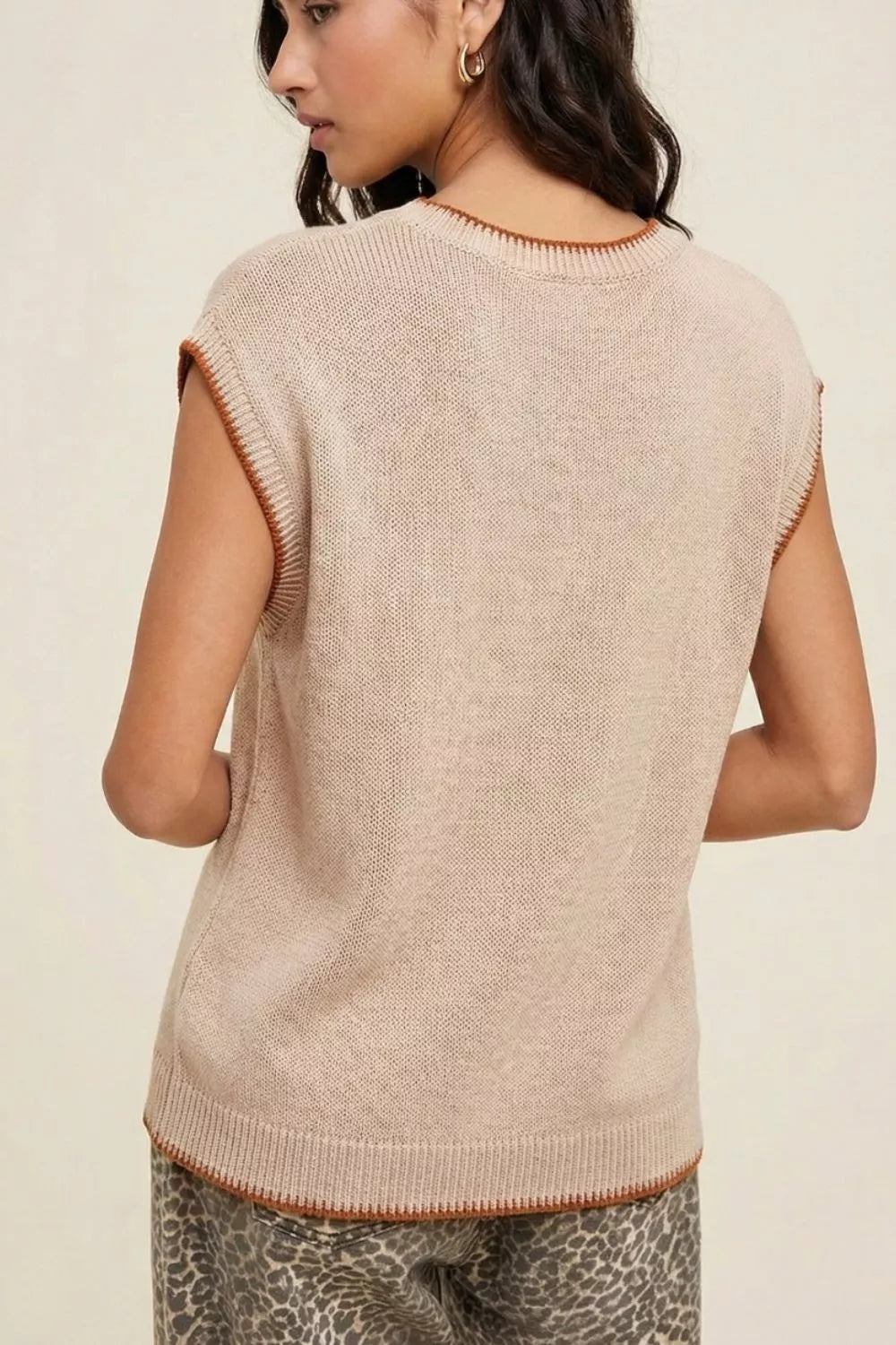Howdy Textured Knit Sweater Vest in beige acrylic with contrast trim, sleeveless, crewneck.