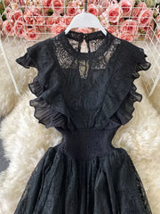 Black lace maxi dress with ruffled sleeves, cutout waist, and high neckline.