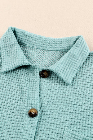 Light Green waffle knit button-down shirt jacket with brown buttons.