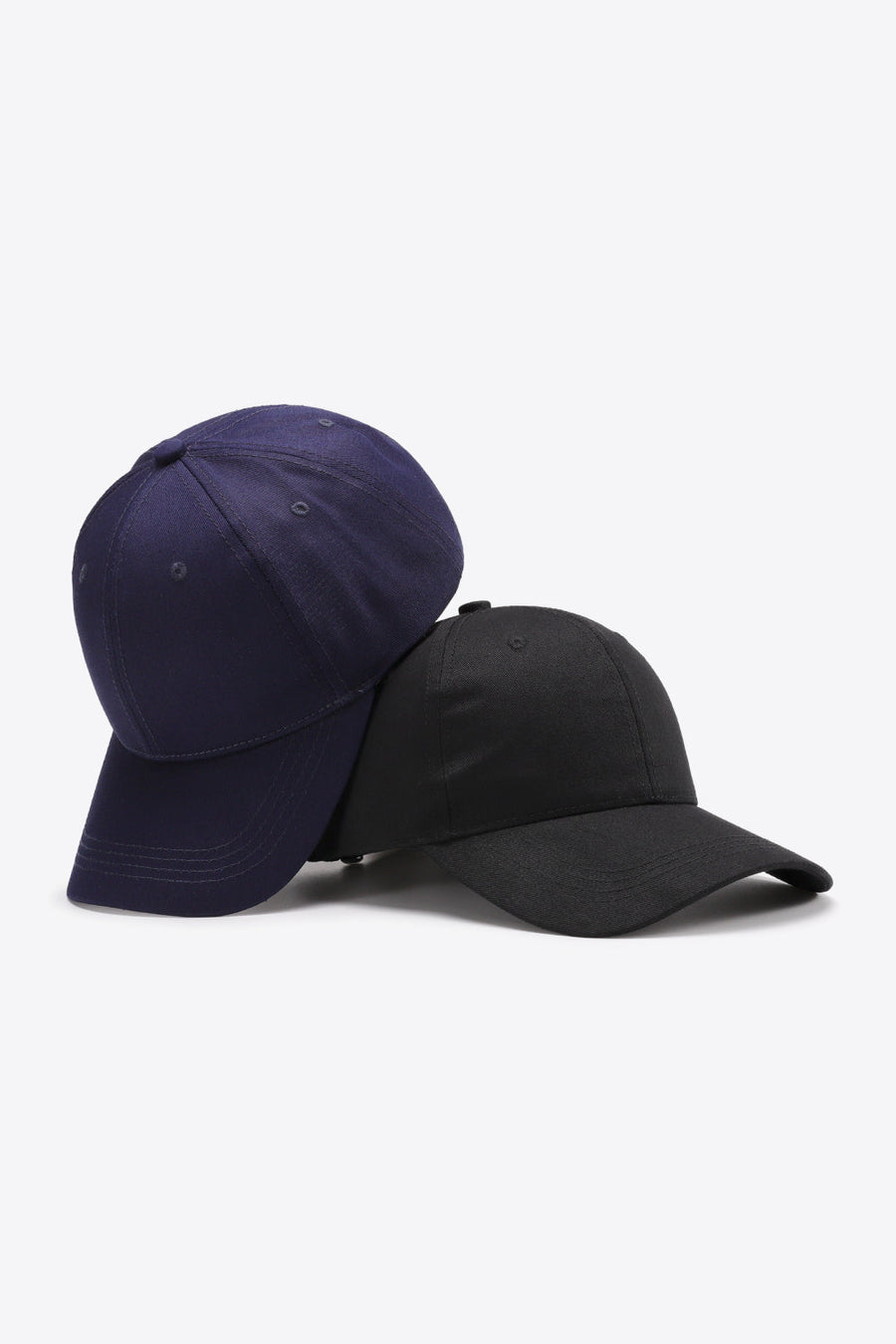 Navy and black cotton twill baseball caps with adjustable strap
