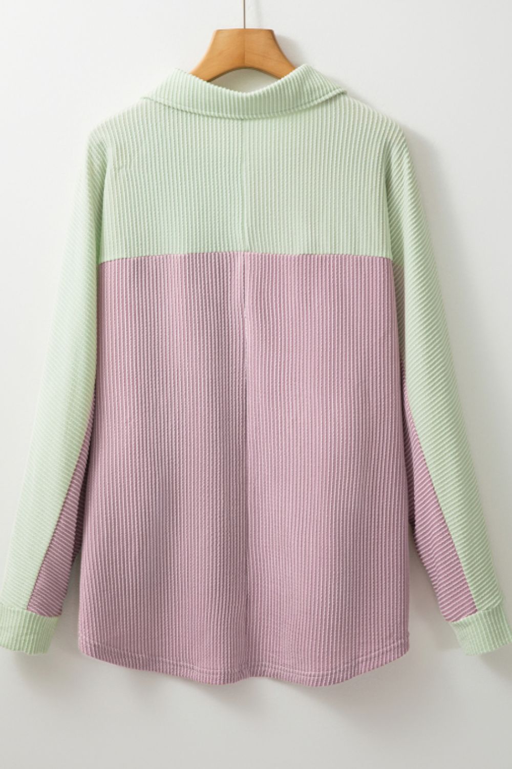 Waffle knit button-up shirt with colorblock design in dusty pink and light green.