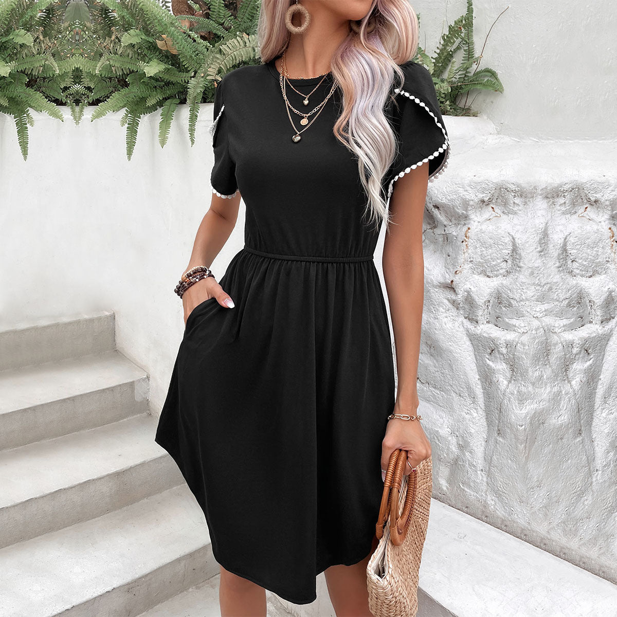 Black scalloped sleeve day dress with elastic waist and pockets.