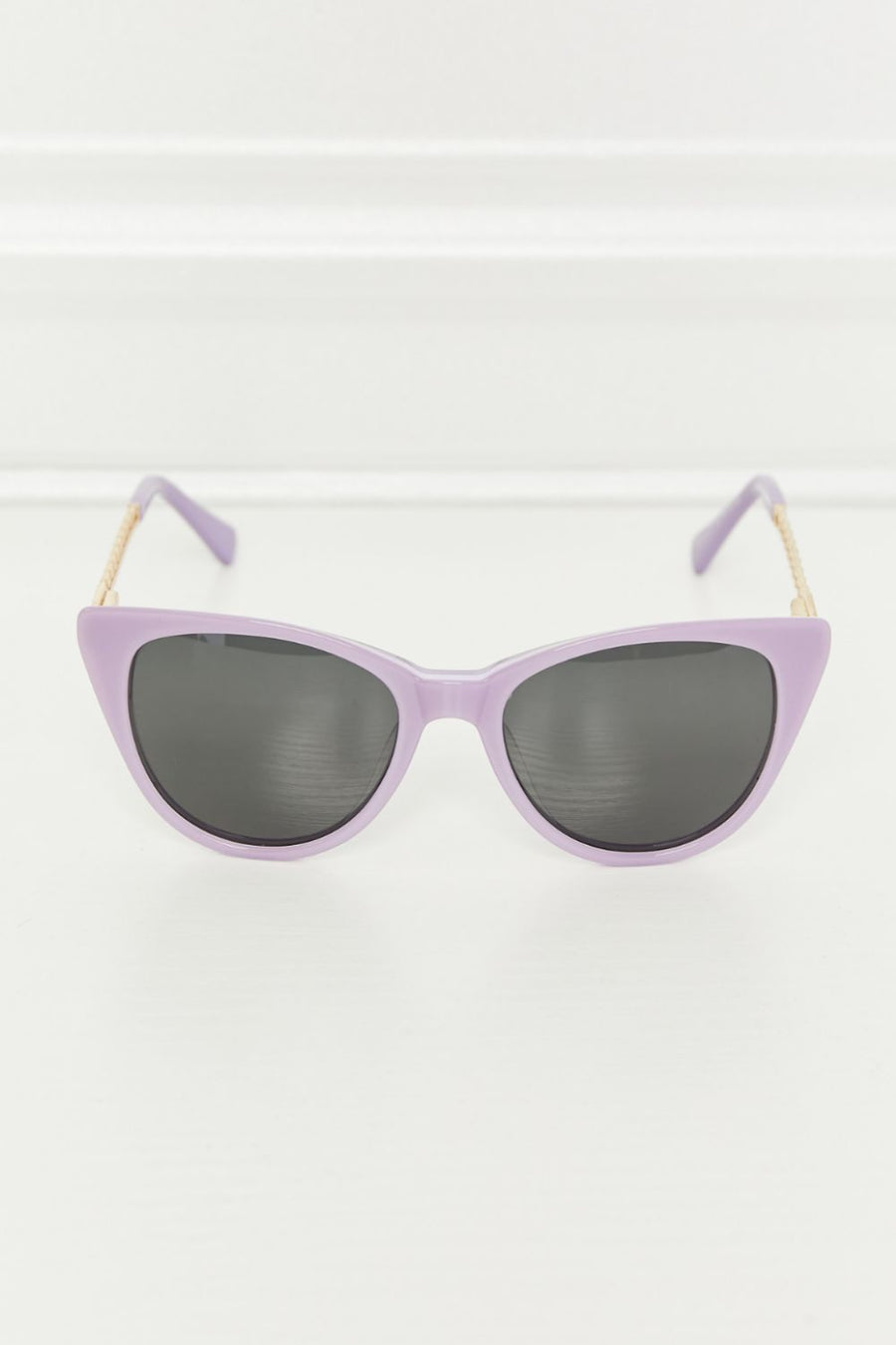 Lavender cat-eye acetate sunglasses with chain detail and dark lenses