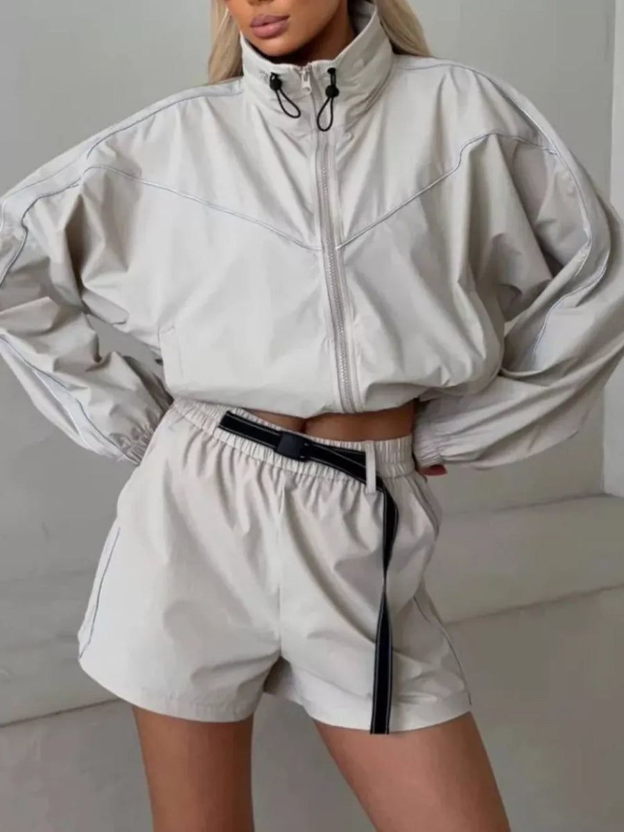 dark brown track jacket with drawstring waist and long sleeve