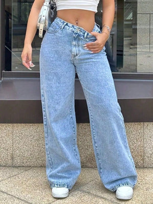 Blue denim wide-leg jeans with pockets and a relaxed fit.