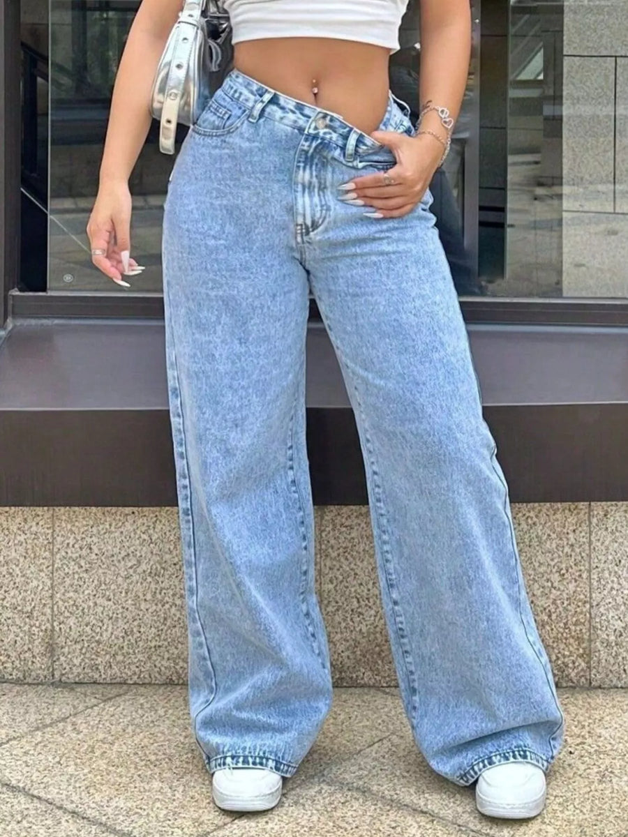 Blue denim wide-leg jeans with pockets and a relaxed fit.