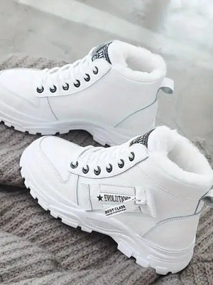 White faux shearling lined platform boots with lace-up closure and detail straps.