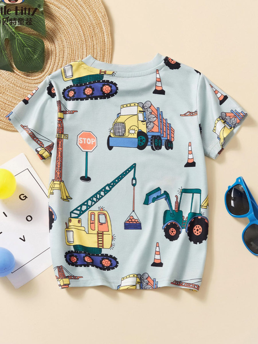 Toddler t-shirt with construction vehicles, cranes, dump trucks, and stop signs on a light blue background.