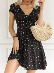Floral tie-front mini dress with short sleeves and a v-neckline.