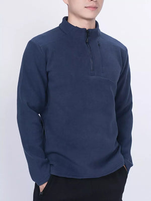 Navy fleece quarter-zip sweatshirt with a zippered chest pocket.