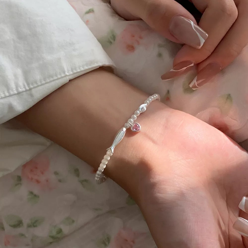 bracelet in ivory featuring pearls and regular fit