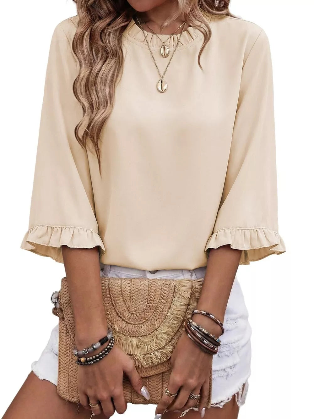 Apricot ruffled mock neck half sleeve shirt with ruffled cuffs.