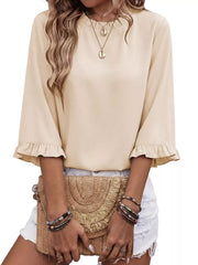 Apricot ruffled mock neck half sleeve shirt with ruffled cuffs.
