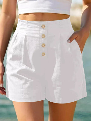 shorts in white featuring button-front and relaxed fit