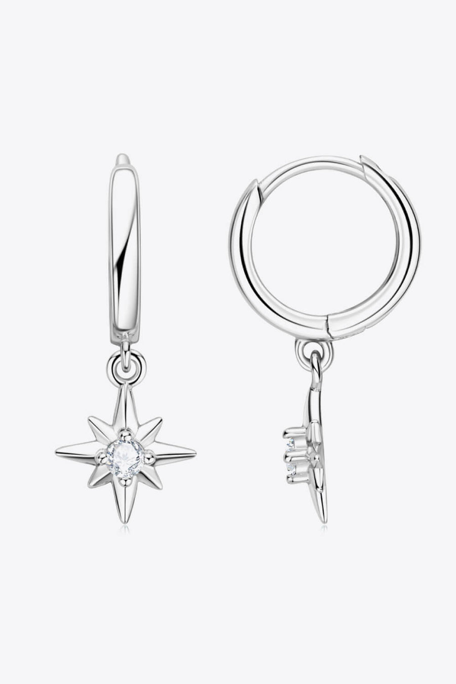 Silver hoop earrings with dangling star charms featuring a central crystal