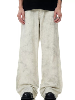 Men's wide-leg pants in marble wheat with a stone-washed pattern and relaxed fit.