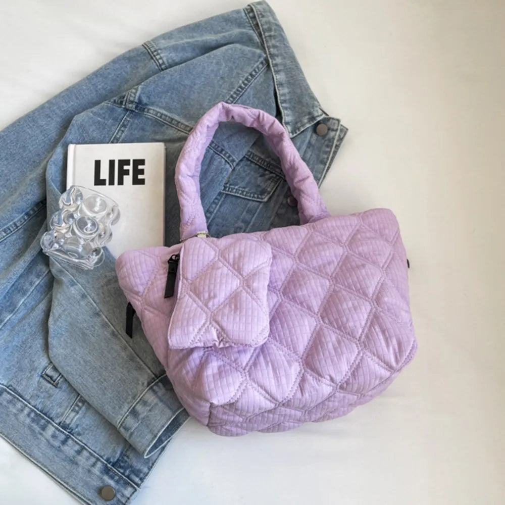 Quilted lilac shopper tote bag with top handles and a front pouch.