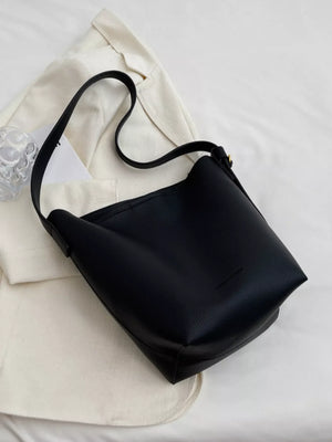 Black minimalist PU leather shoulder bag with adjustable strap