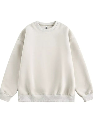 Oversized crew-neck sweatshirt in off-white with ribbed cuffs and hem.