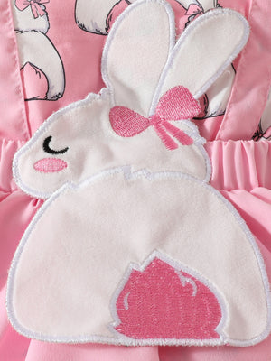 Pink baby dress with bunny applique and bow detail.